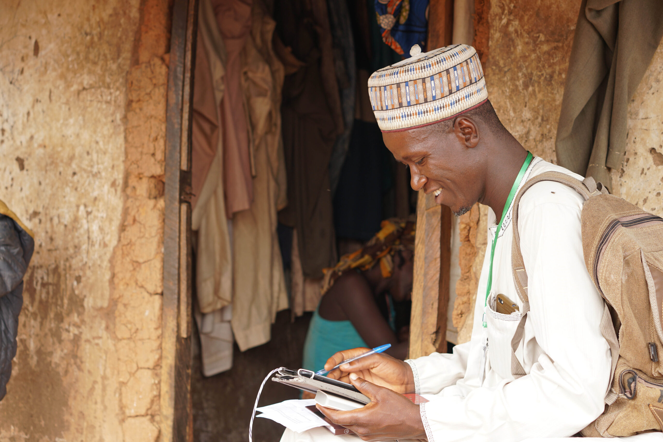 A man is collecting data during a household survey